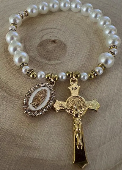 Women’s Catholic prayer bracelet with glossy pearl beads, golden accents, and Virgin Mary centerpiece charm