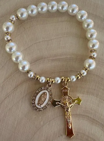 Faith-inspired Catholic bracelet with gold crucifix and pearl beads, handmade devotional jewelry honoring the Virgin Mary
